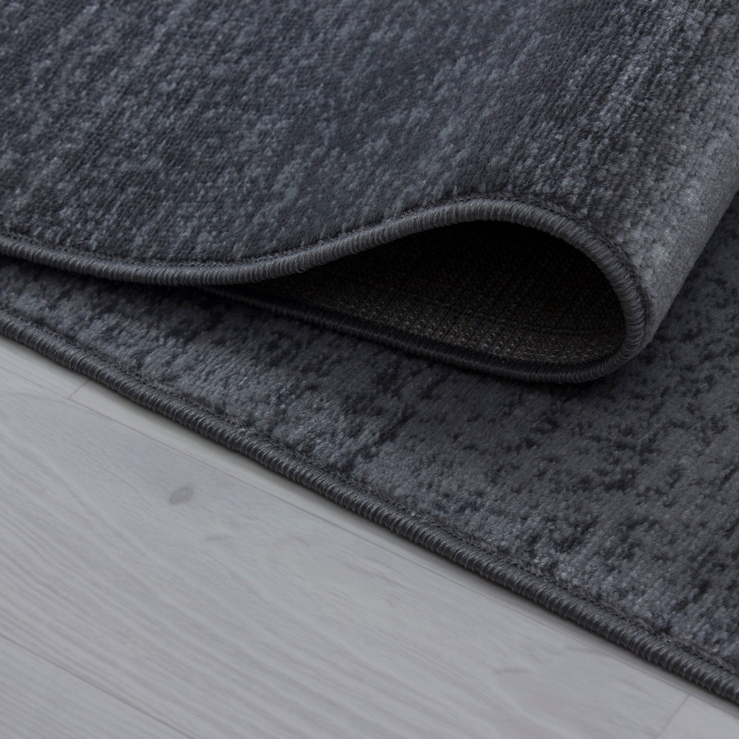 Kurzflor Design Teppich Stern Muster Wohnzimmer Kompassrose Grau Schwarz Meliert